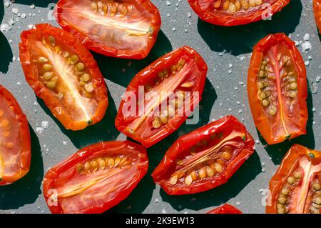 Baby plum tomatoes drying in the sun Stock Photo