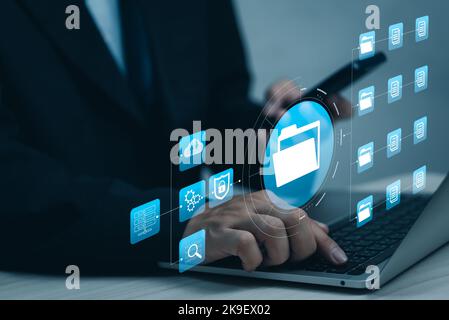 software analyst and Data Management System working on a report with kpi strategy performance management analytics diagram intelligence database serve Stock Photo