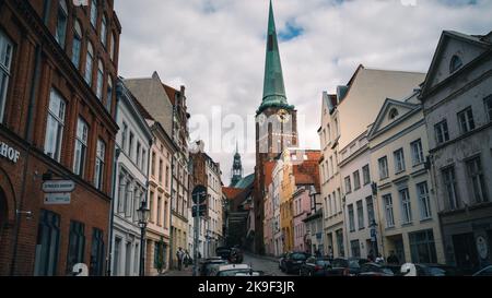 Walking in Lübeck narrow streets towards the Cathedral. Northern Germany, summer 2022. Stock Photo