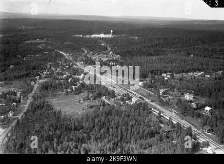 Aerial photo over the station. Straight forward in the picture the sanatorium in Hällnäs. 43 houses were built of this model. Stock Photo