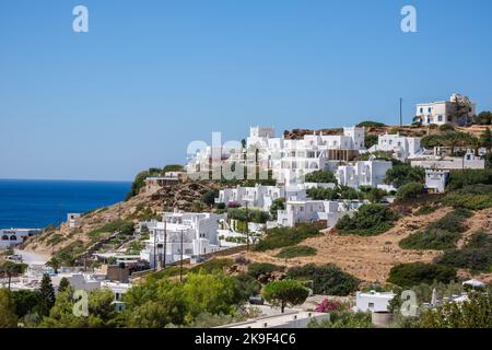 Ios, Greece - September 9, 2022 : View of beautiful whitewashed hotel rooms and restaurants  overlooking the Aegean Sea in Mylopotas Ios Greece Stock Photo