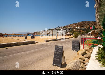 Ios, Greece - September 8, 2022 : A restaurant and beach bar in front of the Mylopotas beach serving breakfast, lunch and dinner Stock Photo