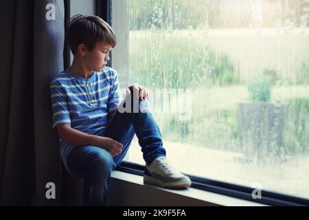 sad alone boy crying in the rain