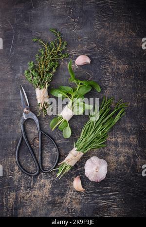 Rosemary, thyme and basil. Fresh garden herbs Stock Photo