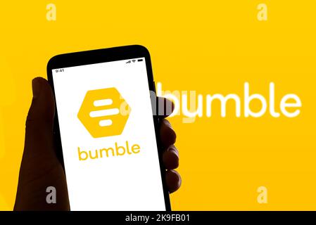 In this photo illustration the online dating app Bumble logo is seen on the screen of a mobile phone. Stock Photo