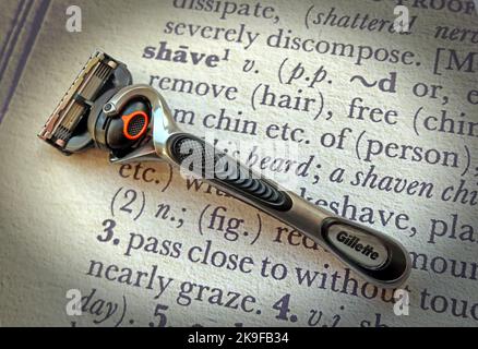 Razor, with expensive blades, on a dictionary definition of 'Razor' Stock Photo