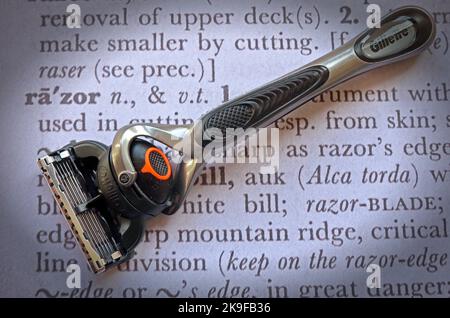 Razor, with expensive blades, on a dictionary definition of 'Razor' Stock Photo