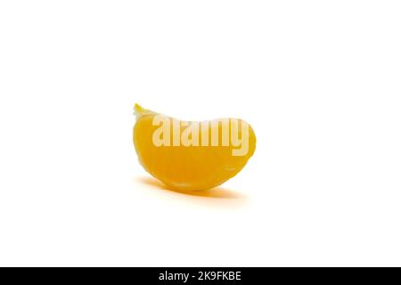 Single yellow slice of satsuma orange (Citrus unshiu) isolated on white background Stock Photo