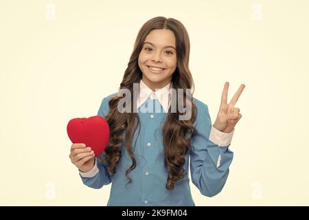 Its time for the party. Happy kid with heart show V sign. Valentines day party. Holiday celebration Stock Photo