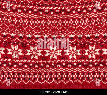 Sweater fabric with Norwegian knitted rose pattern (Selburose) ornament Stock Photo