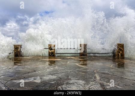 Splashing water at the pier Stock Photo