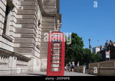 UK red phone box on the London Central Streets. Red British Phone Booth, London background. . High quality photo Stock Photo