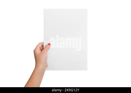 Isolated girl's hand hold a blank paper in a vertical position. Copy presentation mockup Stock Photo