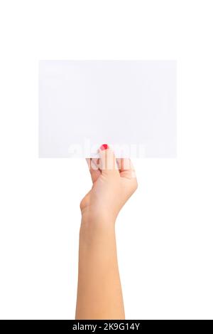Girl's hand holding a small sheet of paper. Blank paper for text presentation. Stock Photo