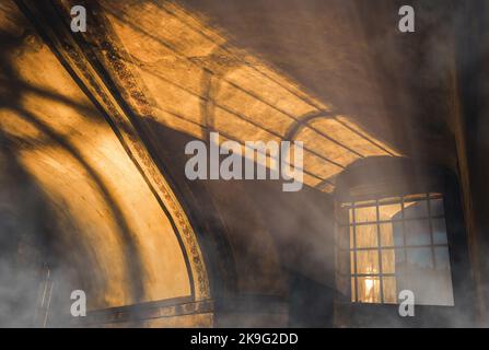 shadows from the lattice in a mysterious corridor in the old room Stock Photo