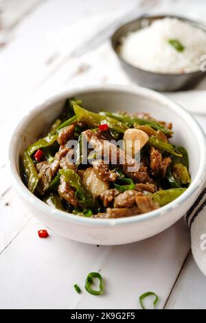 Asian style beef strips pepper stir fry, selective focus Stock Photo