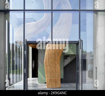 Factory entrance with curvaceous Rattan installation. Ice Ball Factory, Waregem, Belgium. Architect: Enter Architecture Ltd, 2022. Stock Photo