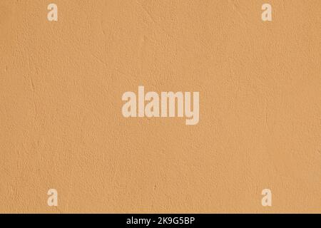 Fine detail light orange textured plaster wall surface Stock Photo