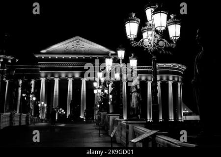 The Archaeological Museum of the Republic of Macedonia, built in neo-classical style, Skopje, North Macedonia. Next to the Vardar River bank at night. Stock Photo