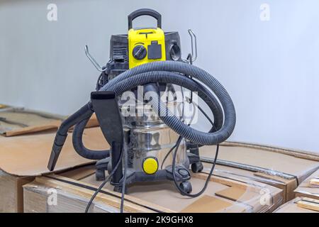 Big Industrial Use Vacuum Cleaner Hoover in Workshop Stock Photo