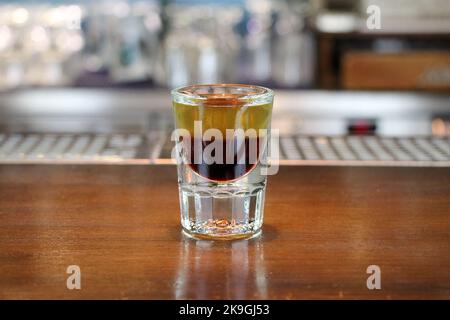 Shot drink - B52 on bar counter Stock Photo