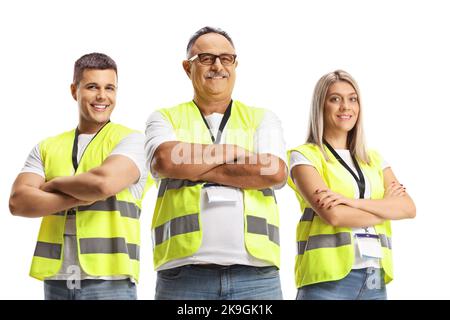 People wearing reflective safety vests and posing with crossed arms isolated on white background Stock Photo