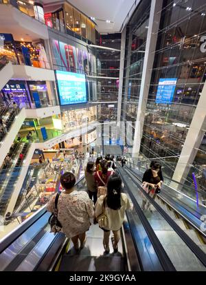 People ride escalators in the modern Pier 21 Shopping Centre in Bangkok, Thailand. Stock Photo