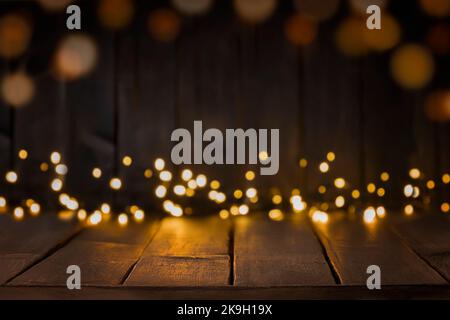 Festive background of dark brown table top with lights bokeh. Copy space, space for products display Stock Photo