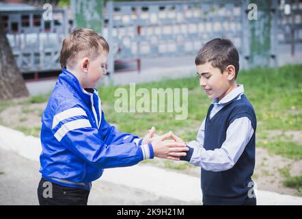 Bila Tserkva, Ukraine, May, 2017: Two schoolchildren playing  Stock Photo