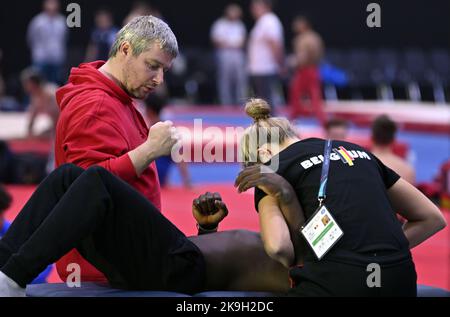 Liverpool, UK. 28th Oct, 2022. Gymnastics trainer Koen Van Damme and Belgian Noah Kuavita pictured during a training session of the Belgian team ahead of the World Artistic Gymnastics Championships in Liverpool, Friday 28 October 2022. The Worlds take place from October 29 until November 6, 2022 in Liverpool, United Kingdom. BELGA PHOTO ERIC LALMAND Credit: Belga News Agency/Alamy Live News Stock Photo