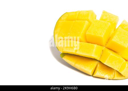 chopped half of ripe mango fruit isolated on white background. Stock Photo