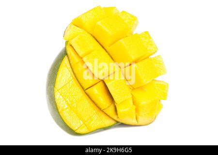 chopped half of ripe mango fruit isolated on white background. Stock Photo