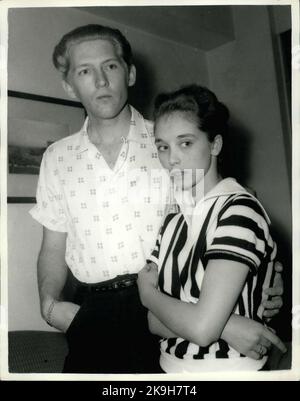 May 23, 1958 - 22 - year - old American rock n' roll singer arrives here with his 15 - year old wife: Jerry Lee Lewis, the American rock n' roll singer, flew into London yesterday with a shock for his fans. For the girl who arrived with him turned out to be his 15 - year - old wife of two months. Her name was Myra, and she is his third wife. Jerry was first married at 15 and again at 17, but this time he says he has found the right girl.When asked if she thought that fifteen was too young to be a wife, Myra explained that back at her home town Memphis, Tennessee, you can marry at the age of te Stock Photo