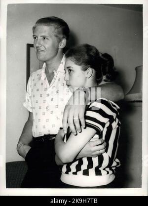 May 23, 1958 - 22 Year-Old American Rock 'N Roll Singer Arrives Here With His 15 Year Old Wife; Jerry Lee Lewis, the American rock ' n roll singer, flew into London yesterday with a shock for his fans. For the girl who arrived with him turned out to be his 15 year old wife of two months. her name was Myra, and she is his third wife. Jerry was first married at 15 and again at 17, but this time he says he has found the right girl. When asked if she thought that fifteen was too young to be a wife, Myra explained that back at her home town Memphis Tennessee, you can marry at the age of ten. Flaxen Stock Photo