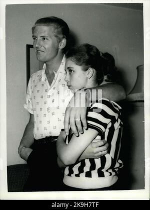 May 23, 1958 - 22 - year - old American rock n' roll singer arrives here with his 15 - year old wife: Jerry Lee Lewis, the American rock n' roll singer, flew into London yesterday with a shock for his fans. For the girl who arrived with him turned out to be his 15 - year - old wife of two months. Her name was Myra, and she is his third wife. Jerry was first married at 15 and again at 17, but this time he says he has found the right girl.When asked if she thought that fifteen was too young to be a wife, Myra explained that back at her home town Memphis, Tennessee, you can marry at the age of te Stock Photo