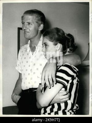 May 23, 1958 - 22 - year - old American rock n' roll singer arrives here with his 15 - year old wife: Jerry Lee Lewis, the American rock n' roll singer, flew into London yesterday with a shock for his fans. For the girl who arrived with him turned out to be his 15 - year - old wife of two months. Her name was Myra, and she is his third wife. Jerry was first married at 15 and again at 17, but this time he says he has found the right girl.When asked if she thought that fifteen was too young to be a wife, Myra explained that back at her home town Memphis, Tennessee, you can marry at the age of te Stock Photo