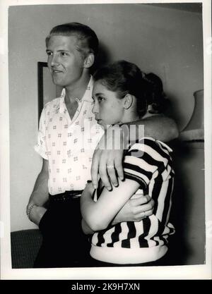 May 23, 1958 - 22 Year-Old American Rock 'N Roll Singer Arrives Here With His 15 Year Old Wife; Jerry Lee Lewis, the American rock ' n roll singer, flew into London yesterday with a shock for his fans. For the girl who arrived with him turned out to be his 15 year old wife of two months. her name was Myra, and she is his third wife. Jerry was first married at 15 and again at 17, but this time he says he has found the right girl. When asked if she thought that fifteen was too young to be a wife, Myra explained that back at her home town Memphis Tennessee, you can marry at the age of ten. Flaxen Stock Photo