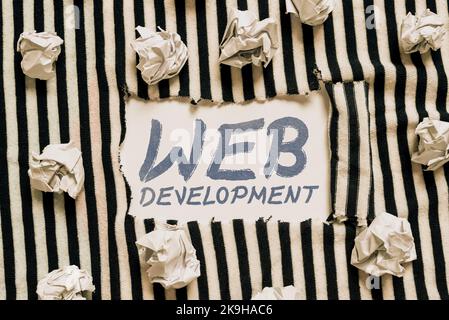 Sign displaying Web Development. Business overview work involved in developing a website for the Internet Typing Program Functional Descriptions Stock Photo