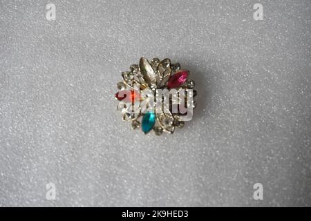 ring with stone and other jewellery isolated in off white background Stock Photo