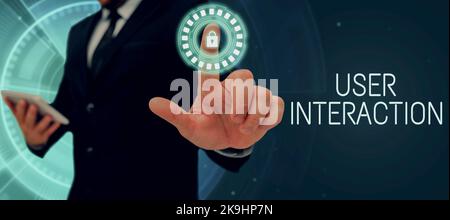 Writing displaying text User Interaction. Business idea how the customer acts on the system and vice versa Businessman in suit holding tablet Stock Photo
