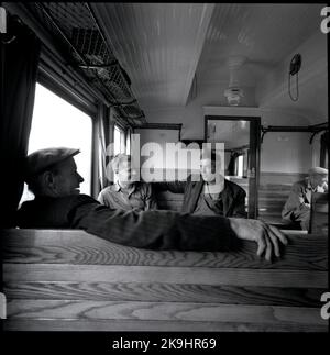 Travelers in a passenger car Stock Photo