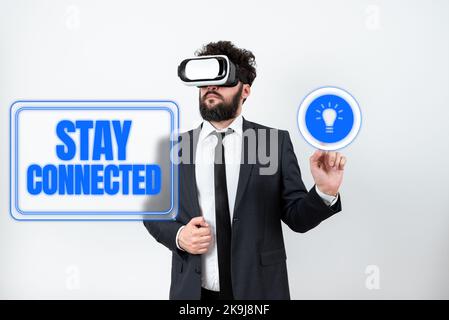 Text sign showing Stay Connected. Word Written on secure from threat of danger, harm or place to keep articles Illustration With Man Typing New Ideas Stock Photo