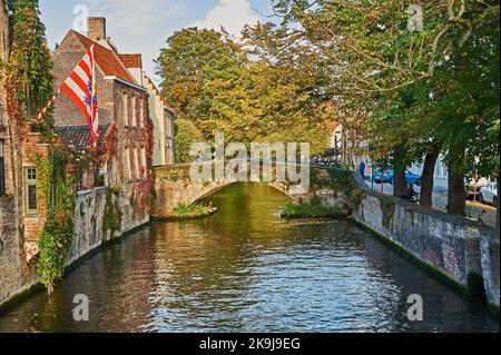Autumn canal scene on the Groenerei in Bruges, Belgium Stock Photo