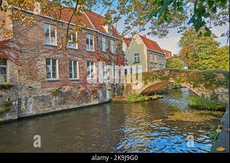 Autumn canal scene on the Groenerei in Bruges, Belgium Stock Photo