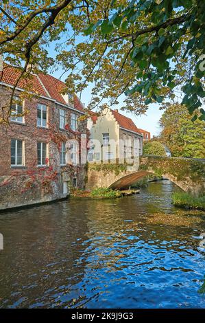 Autumn canal scene on the Groenerei in Bruges, Belgium Stock Photo