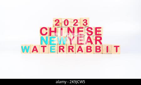 Chinese new year 2023 year of the water rabbit text on wooden cubes or boxes. Chinese Zodiac sign water rabbit concept idea background. Stock Photo