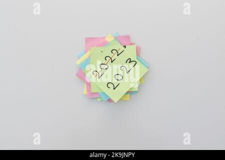 New year 2023 start and 2022 finished concept hand written on a sticky note Stock Photo