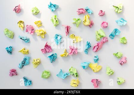 Colorful crumbled paper sticky notes on a white isolated background Stock Photo