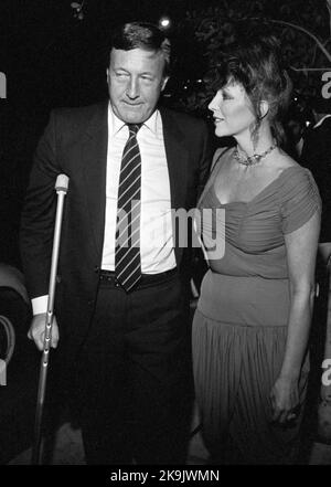 Joan Collins and Ron Kass Circa 1980's  Credit: Ralph Dominguez/MediaPunch Stock Photo