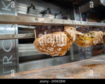 panettone cooking secrets concept hanging up down in the kitchen Stock Photo